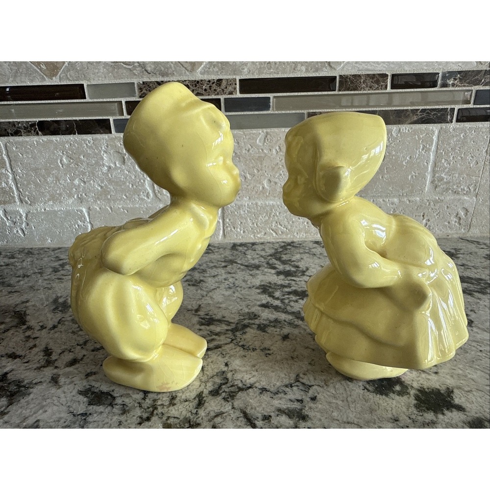 Vintage Yellow kissing dutch boy and girl